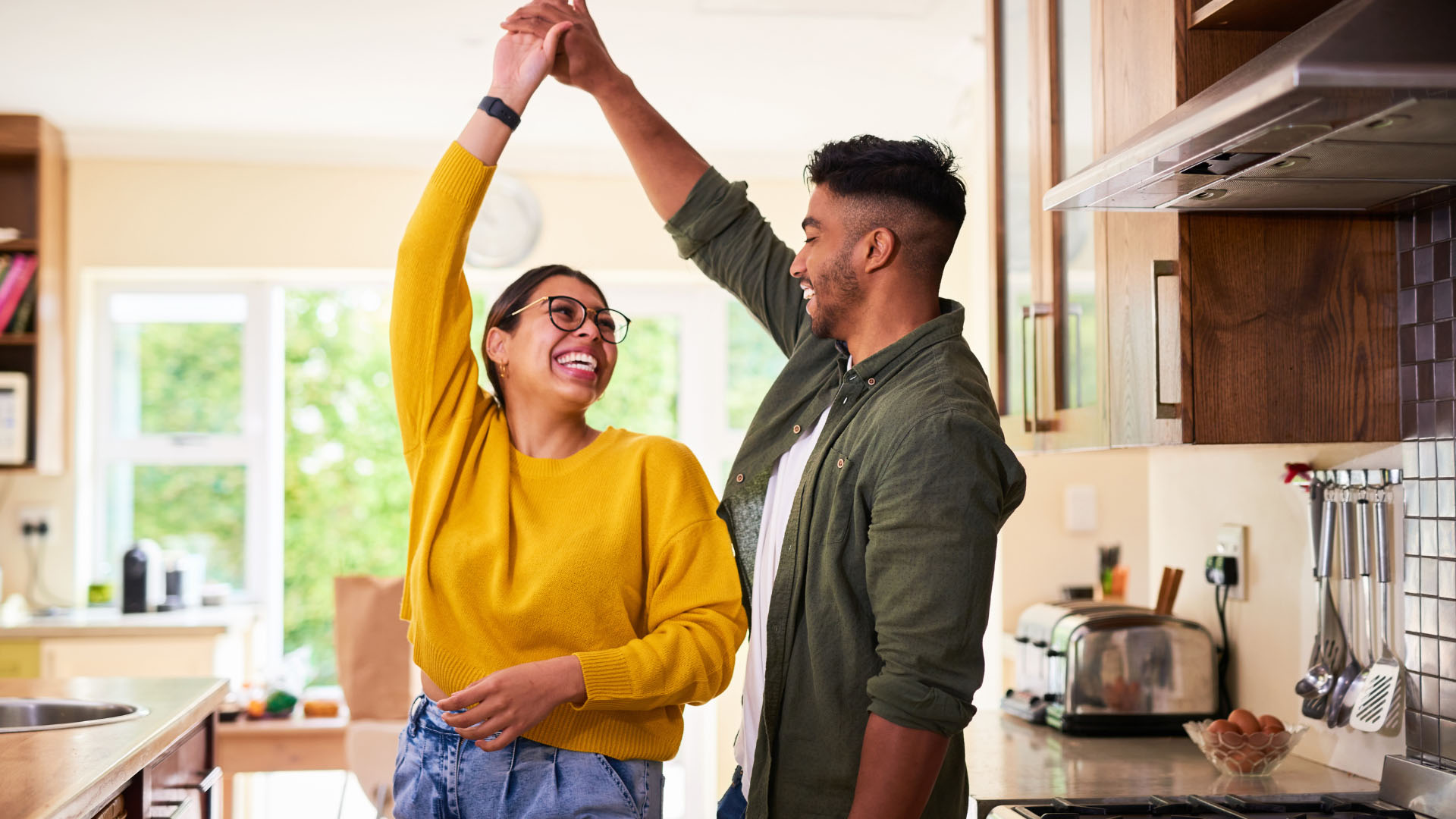 Couple dancing in kitchen