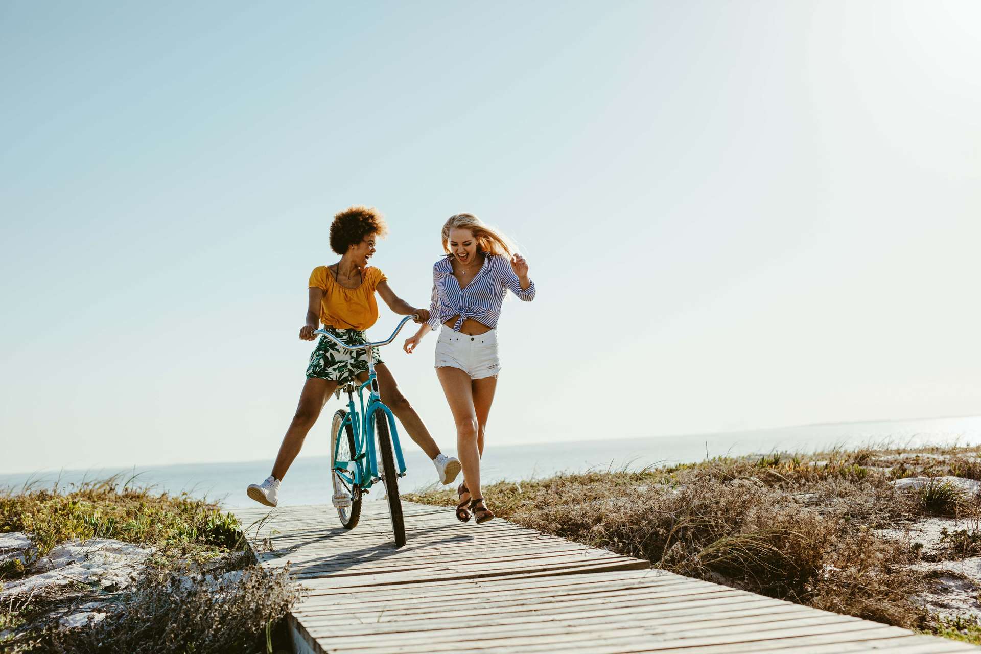 Girls having fun riding a bicycle